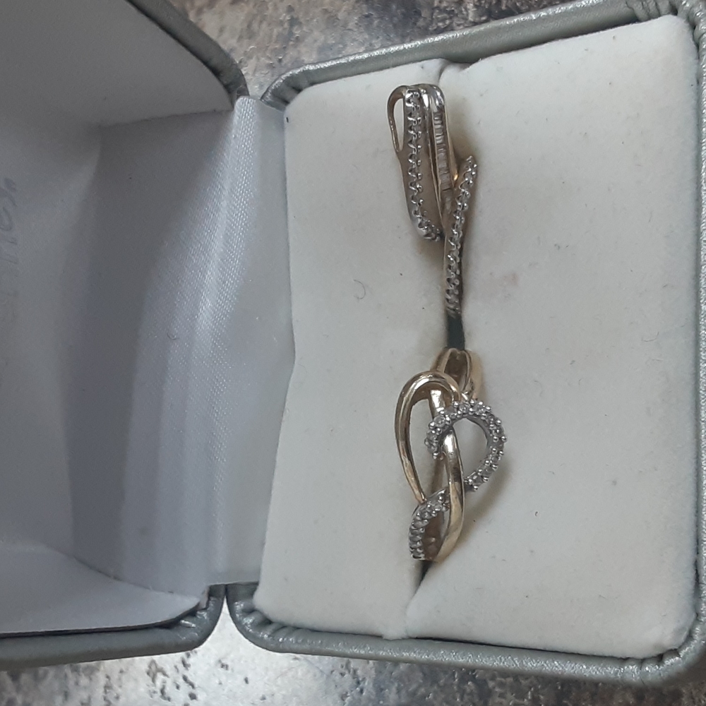 A 10 karat diamond ring and matching pendent